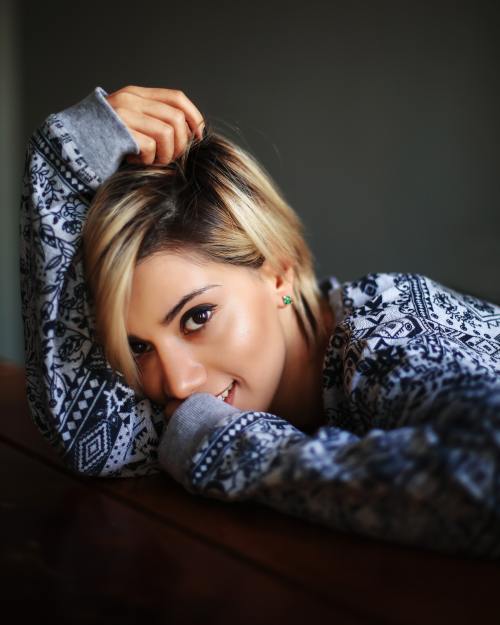 Woman with Blonde Bob Playing with Her Hair