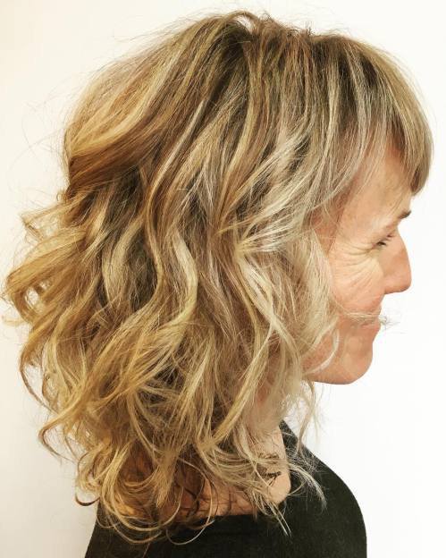 Medium Curly Hairstyle With Bangs